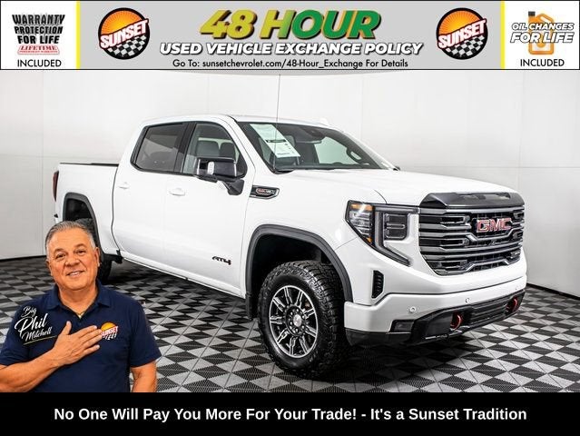 2025 GMC Sierra 1500 AT4 in Summit White — front three-quarter view